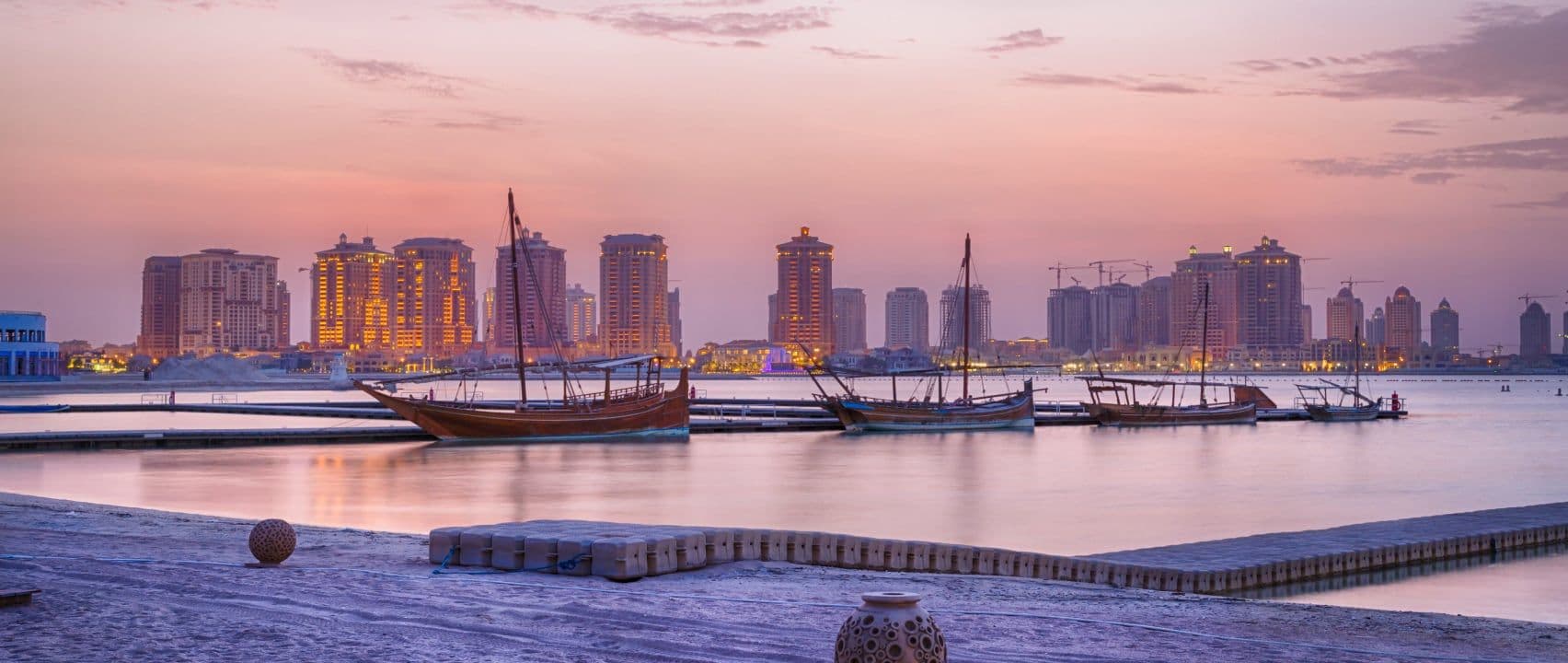 The Doha Corniche curving along the bay